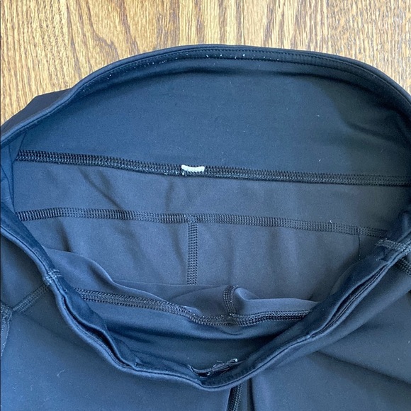 Black, cropped Lululemon leggings with pockets, ruched bottoms and zipped pocket - Picture 8 of 15